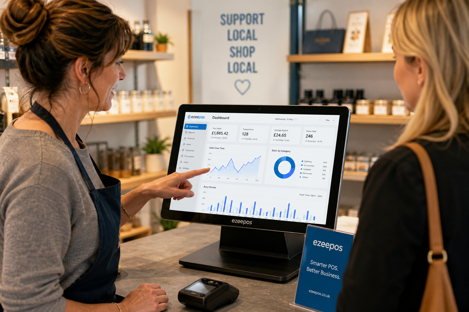 How Better Reporting Helps Independent Shops Make Smarter Decisions, a realistic photorealistic marketing-style blog image for a UK independent retail shop interior with a modern touchscreen EPOS terminal on the counter showing a clean sales dashboard with charts, daily figures and busy period analytics, a shop owner reviewing the screen while serving a customer, subtle blue brand accents in the interface and signage, clean counter area with products in the background, warm natural lighting, shallow depth of field, premium but realistic commercial photography style, friendly and professional atmosphere, the POS technology clearly visible and central to the composition, suitable as a WordPress featured image for ezeepos.